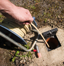 Jim is doing a septic tank cleaning